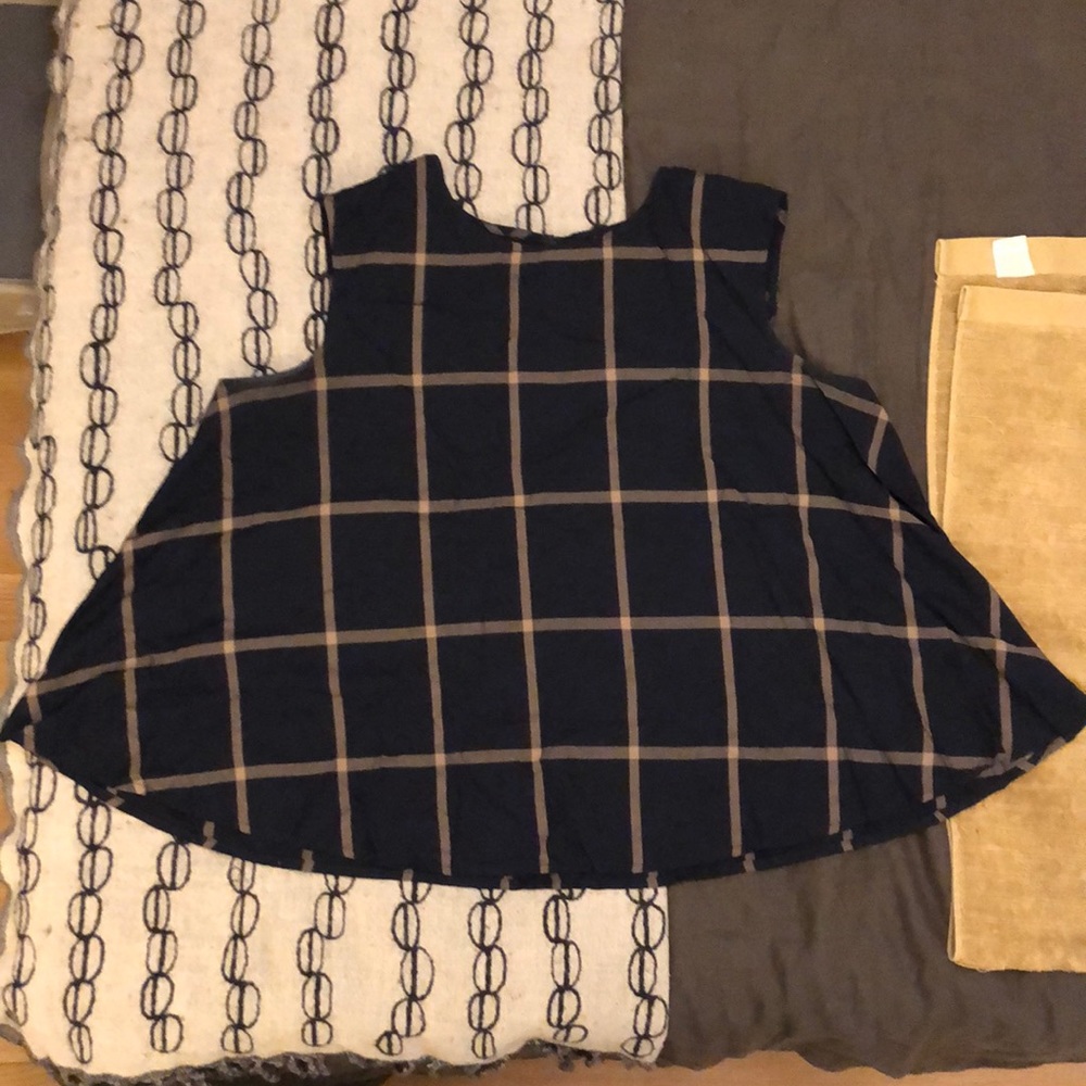 Navy blue sleeveless swing blouse with tan plaid